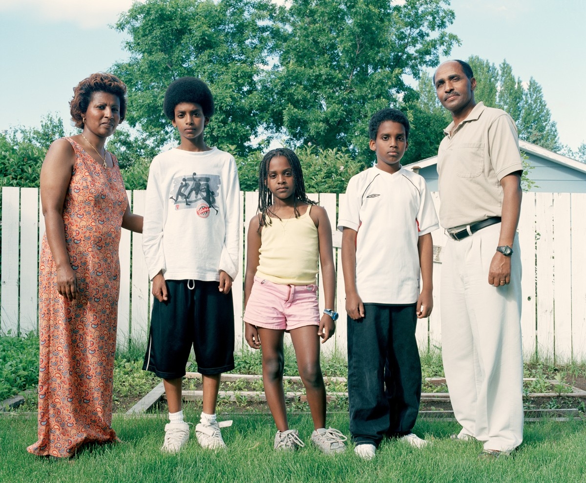 Group photo of a Black family outside.